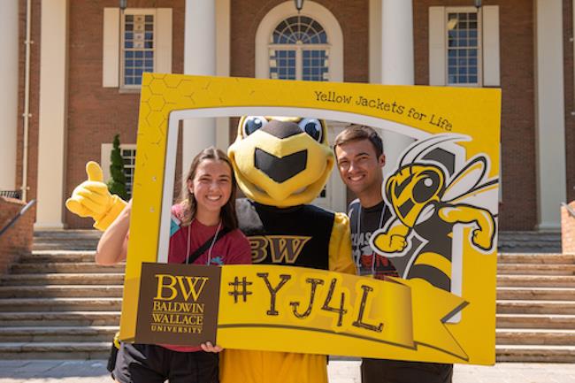 BW student hold phone with mobile credentials